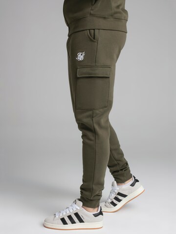Tapered Pantaloni cargo di SikSilk in verde