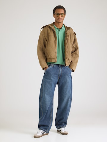 LEVI'S ® Poloshirt 'Housemark' in Grün