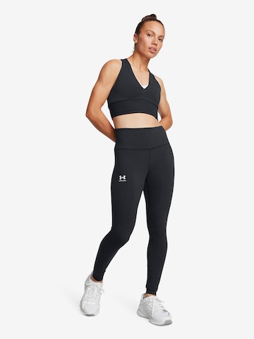 UNDER ARMOUR Skinny Športne hlače 'Rival' | črna barva: sprednja stran