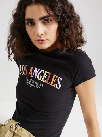 juoda AÉROPOSTALE Marškinėliai 'LOS ANGELES CALIFORNIA'