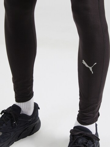 Skinny Pantaloni sportivi 'RUN FAVORITES' di PUMA in nero