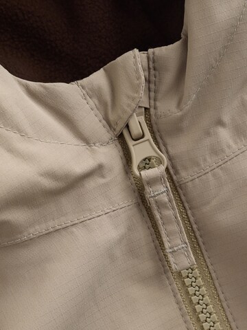 Next Tussenjas in Beige