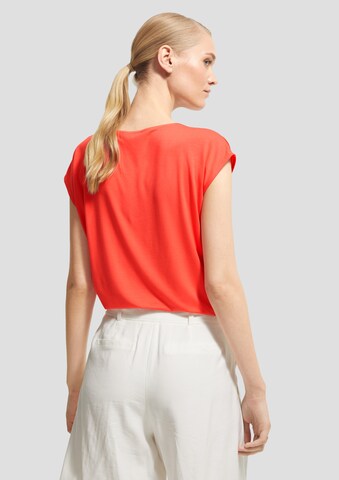 Bluză de la COMMA pe portocaliu: spate