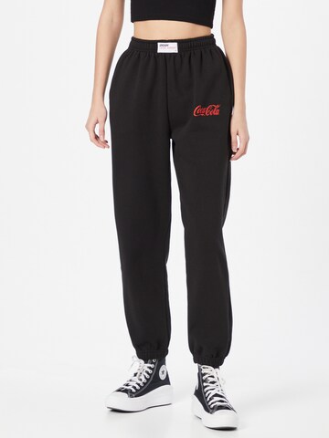 LOCAL HEROES Pants 'COCA COLA' in Black: front
