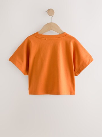 T-Shirt Next en orange