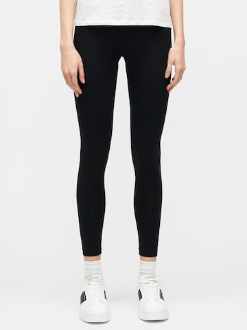 Skinny Pantalon de sport EA7 Emporio Armani en noir : devant