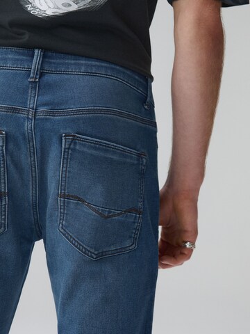 Next Slimfit Farmer 'Motion Flex' - kék