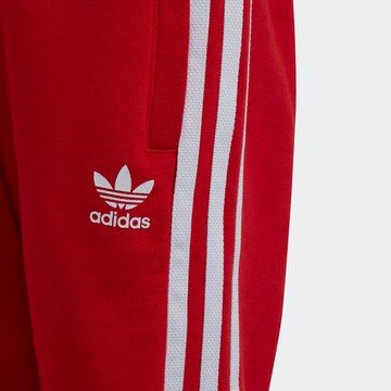 ADIDAS ORIGINALS Strój do biegania 'Adicolor Crew' w kolorze czerwony