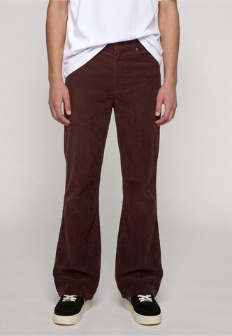 Karl Kani Flared Pants in Brown: front