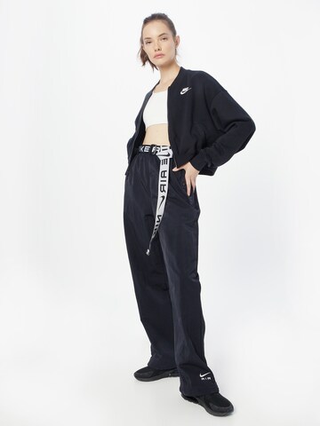 Nike Sportswear Lużny krój Spodnie 'Air' w kolorze czarny