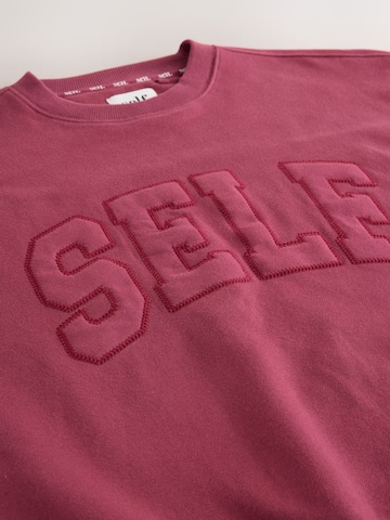 Sweat-shirt self. en rouge
