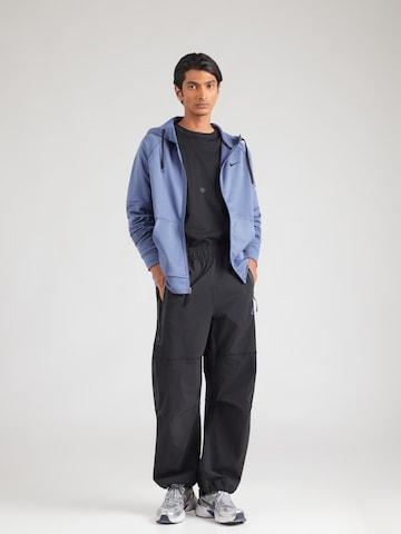 NIKE - Casaco de treino em moletão em azul