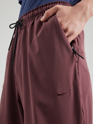 NIKE Tapered Sports trousers 'UNLIMITED' in Red