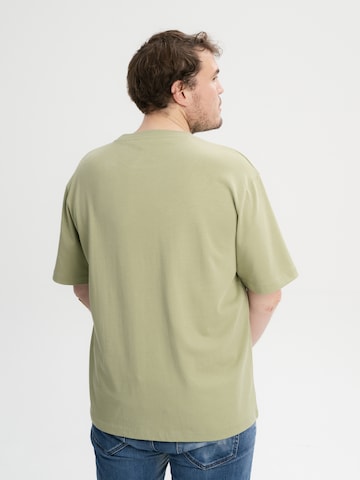MELA T-shirt 'Bhajan' i grön