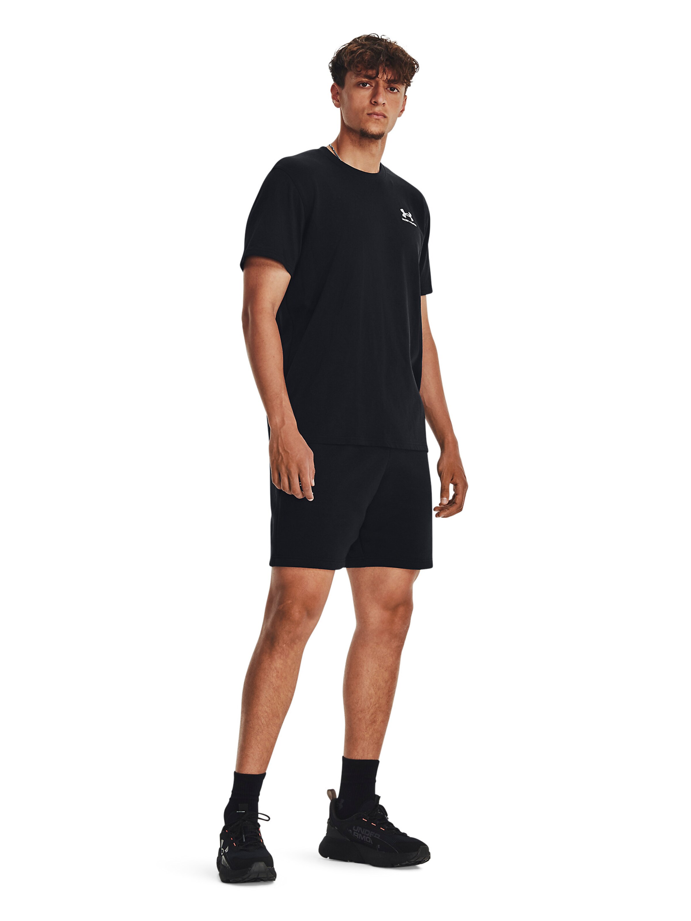 UNDER ARMOUR Loose fit Sports trousers 'Essential' in Black: front