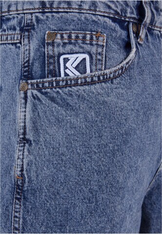 Karl Kani - Flared Calças de ganga ' KMI-PL063-091-11 KK Retro Baggy Workwear Denim ' em azul