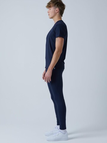 Coupe slim Pantalon de sport 'Long Running Tights' SPORTKIND en bleu