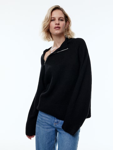 EDITED Пуловер 'Xamira' в черно: отпред