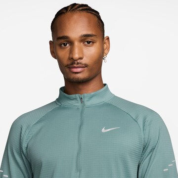 NIKE Performance Shirt 'WINTRZD STRIDE' in Blue