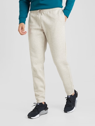 UNDER ARMOUR Tapered Workout Pants 'Essential' in Beige: front