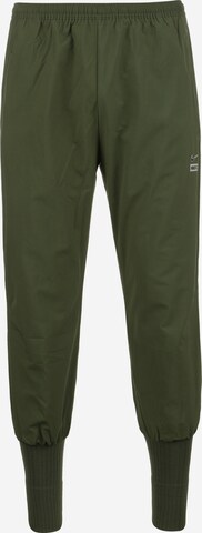 Pantalon de sport NIKE en vert : devant