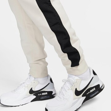 Nike Sportswear Tapered Hose in Beige