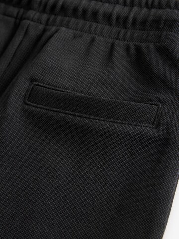Next Tapered Hose in Schwarz