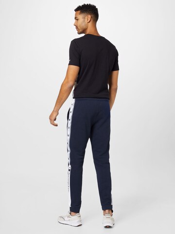 Champion Authentic Athletic Apparel Zwężany krój Spodnie w kolorze niebieski