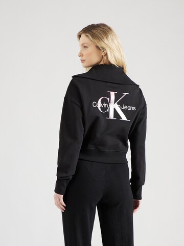 Veste de survêtement Calvin Klein Jeans en noir : devant