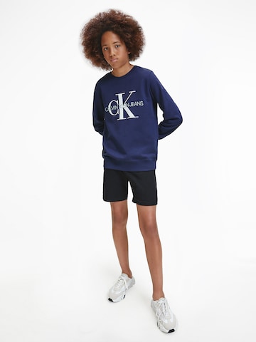 Calvin Klein Jeans كنزة رياضية بلون أزرق