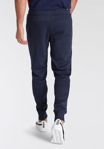 PUMA Tapered Sportbroek in Blauw