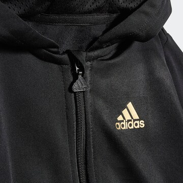 Costum de trening 'Future Icons Shiny Allover Print' de la ADIDAS SPORTSWEAR pe negru