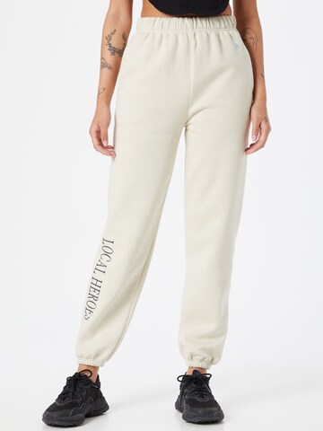 LOCAL HEROES Tapered Trousers in Beige: front