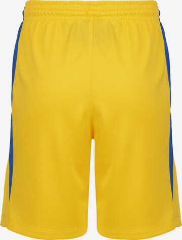 NIKE Loose fit Workout Pants 'Team Stock 20' in Yellow