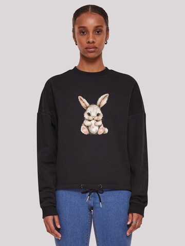 F4NT4STIC Sweatshirt 'Niedlicher Osterhase mit Ei' in Schwarz: Vorderseite