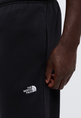 Tapered Pantaloni 'EVOLUTION SIMPLE DOME' di THE NORTH FACE in nero