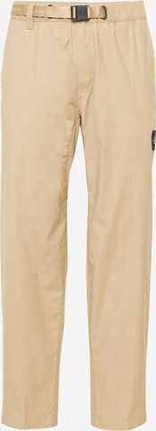 Pantaloni de la Calvin Klein Jeans pe bej: față