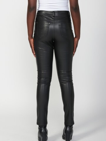 Skinny Pantaloni di KOROSHI in nero