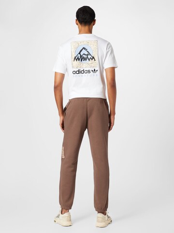 ADIDAS SPORTSWEAR Tapered Workout Pants 'All Szn X Logomania' in Brown