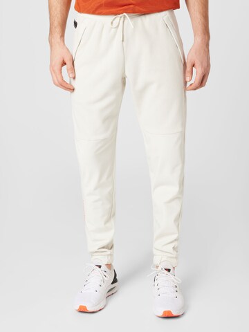 UNDER ARMOUR Tapered Workout Pants 'Rush' in Beige: front