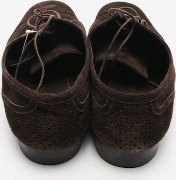 Louis Vuitton Flats & Loafers in 42,5 in Brown