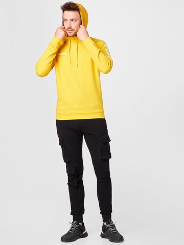 Hummel - Camiseta deportiva en amarillo