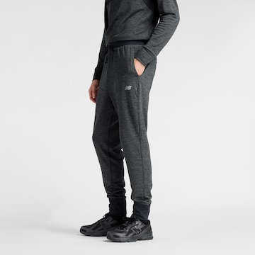 Effilé Pantalon de sport 'Athletics Heat Grid' new balance en noir