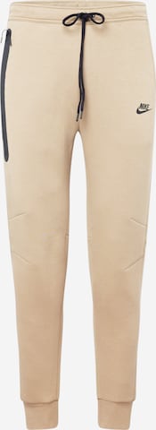 Pantaloni 'Tech Fleece' de la Nike Sportswear pe bej: față