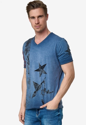 Rusty Neal Cooles T-Shirt mit V-Ausschnitt in Blau: predná strana