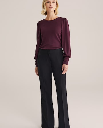 Flared Pantaloni con piega frontale di WE Fashion in nero