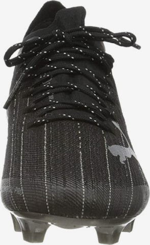 Chaussure de foot 'ULTRA 1.1 FG/AG' PUMA en noir