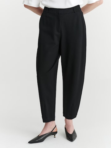 TATUUM - Loosefit Pantalón en negro: frente