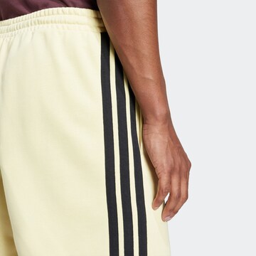 ADIDAS SPORTSWEAR Regular Sports trousers 'Essential' in Yellow