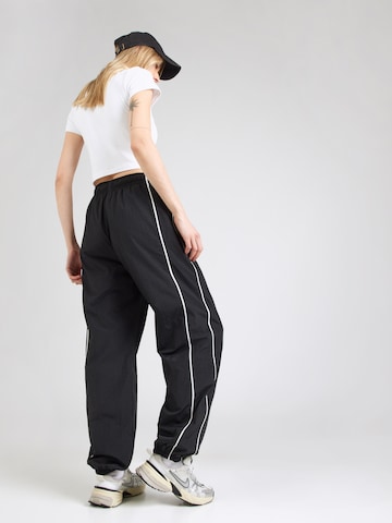 Nike Sportswear Tapered Παντελόνι 'SPEED' σε μαύρο